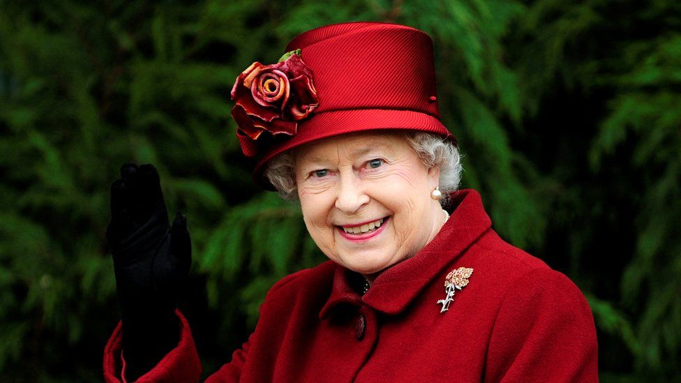 The Queen waving
