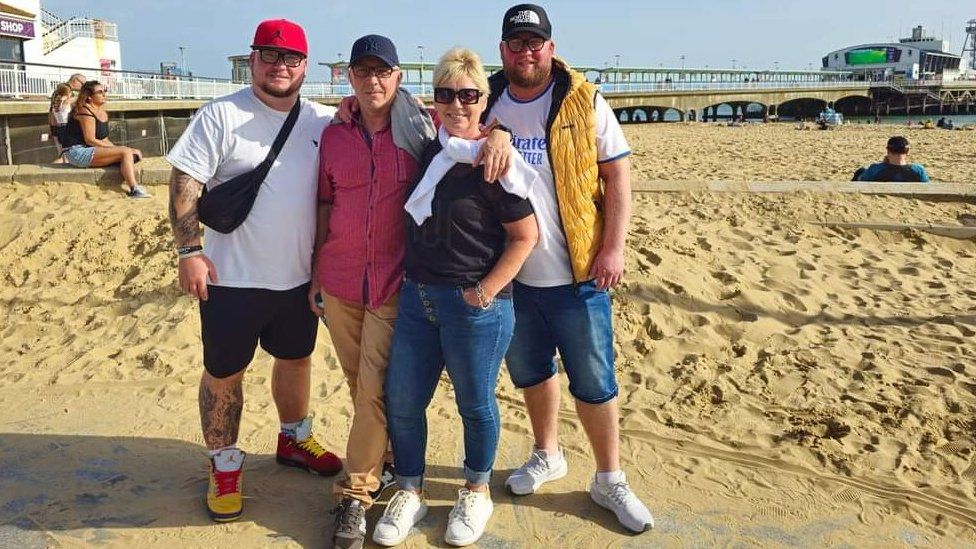 Michal Kaminski with his parents and younger brother Rafal