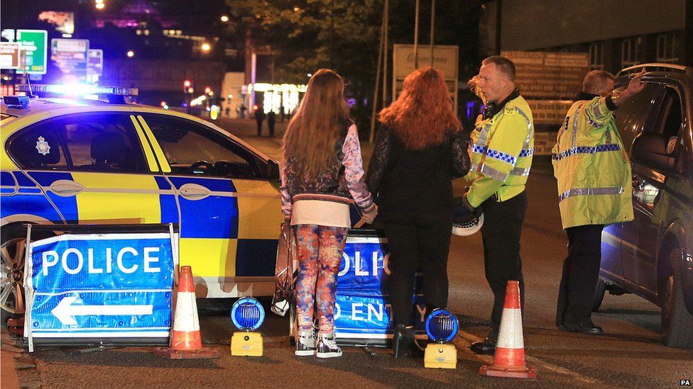 Police talking to Ariana Grande concert-goers