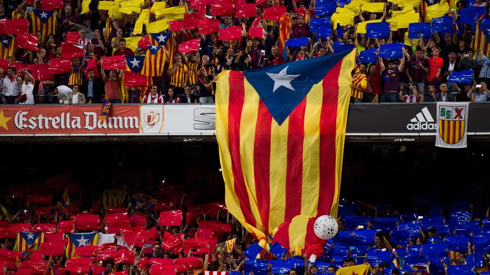 A pro-independence of Catalonia flag is shown by supporters of FC Barcelona as Spanish National Anthem is played before the Copa del Rey Final between Athletic Club and FC Barcelona at Camp Nou on May 30, 2015 in Barcelona, Spain