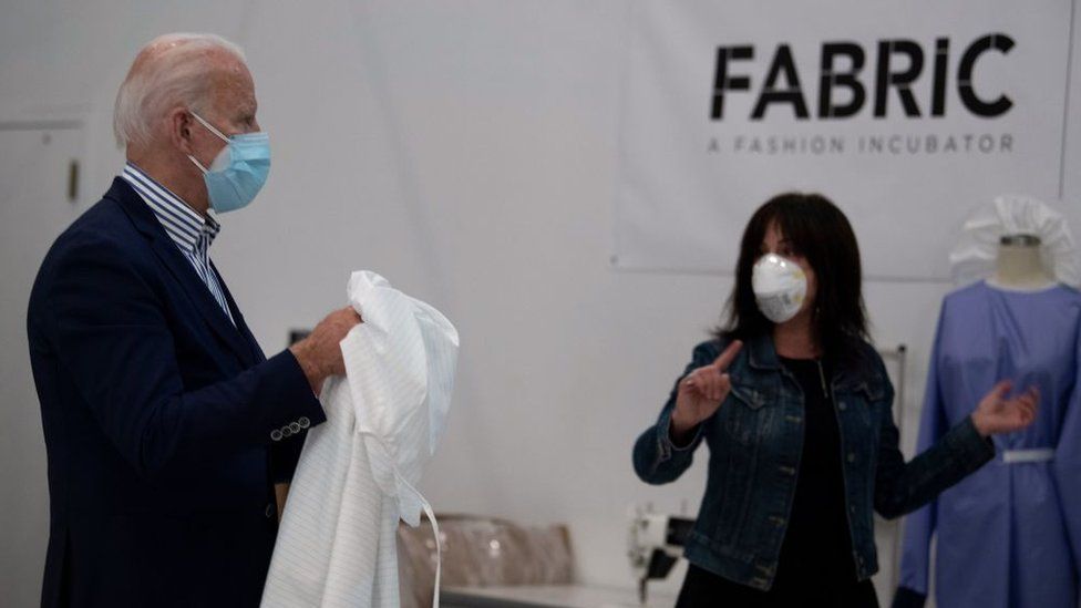 Biden tours a fabric company making PPE