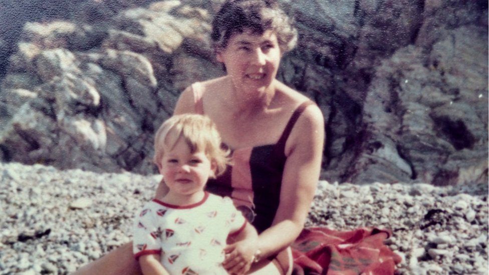 Joyce Currie at the ‘southern cliffs’ end of Fairbourne beach in 1979 with grandson Tom