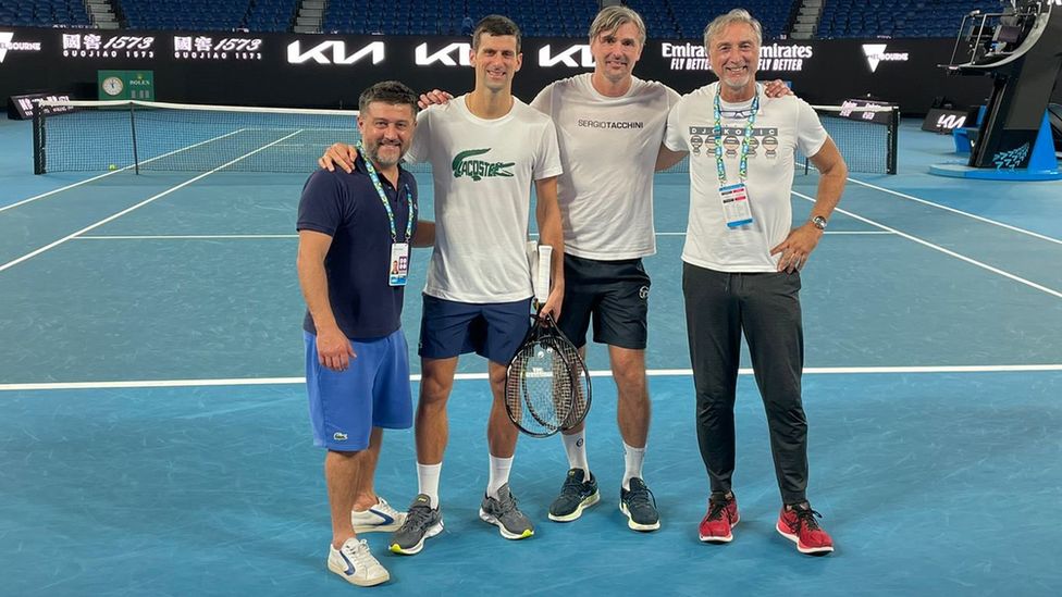 Novak Djokovic with his team on court at the Rod Laver Arena