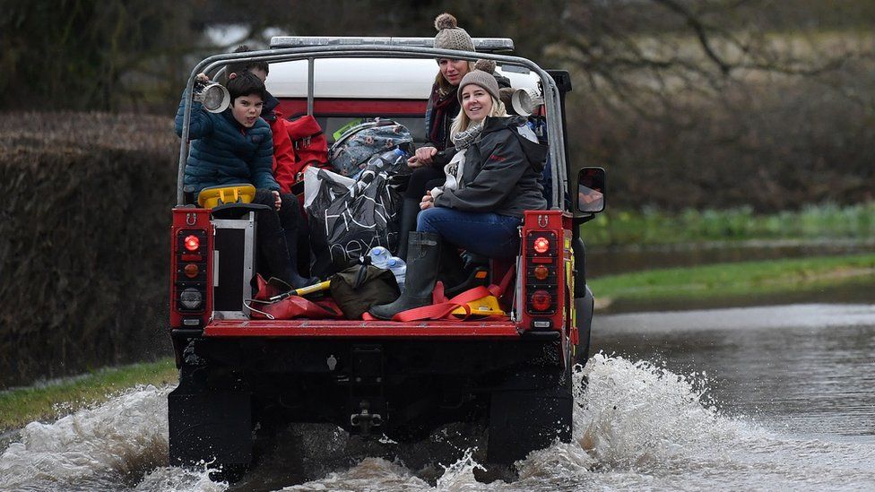 Fire and Rescue 4x4 vehicle driving through floods near Hereford