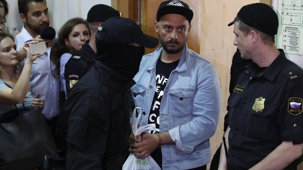 Kirill Serebrennikov (second from R) outside Basmanny district court in Moscow, Russia, 23 August 2017