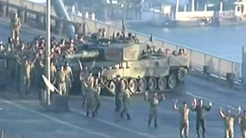 Soldiers with their hands up on Istanbul's Bosporus Bridge