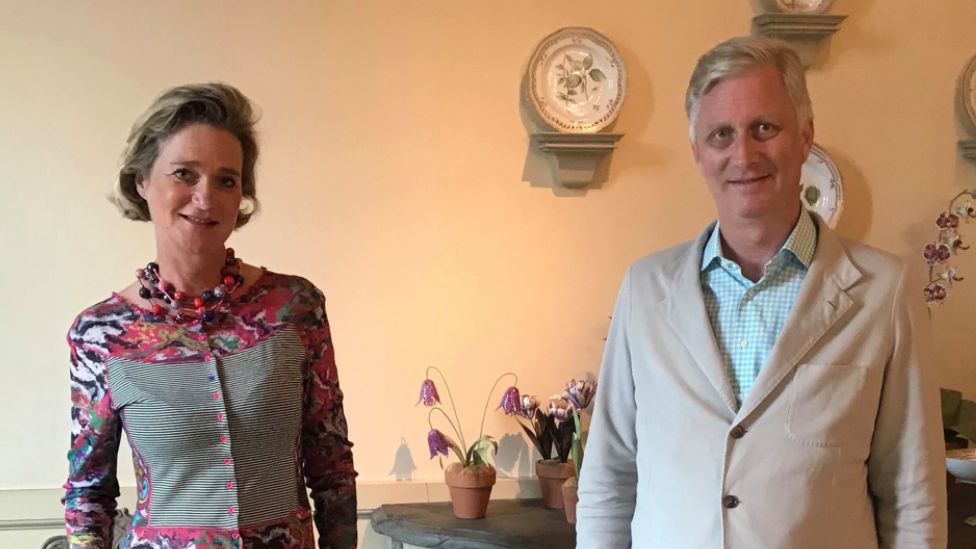 Belgian Princess Delphine (L) stands next to her brother, King Philippe