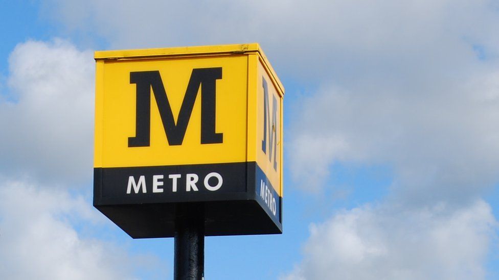 Metro logo at a station