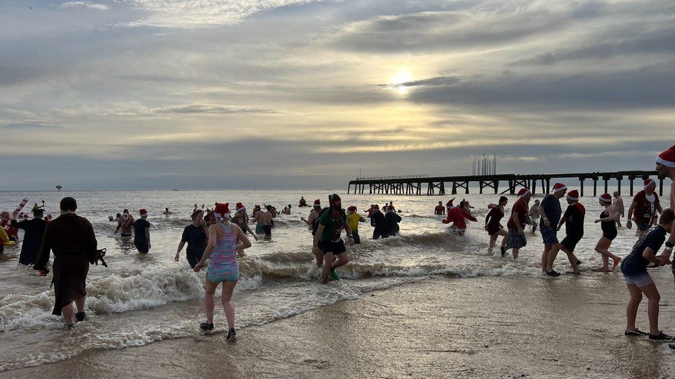 Swimmers taking part in a Christmas Day swim in Lowestoft