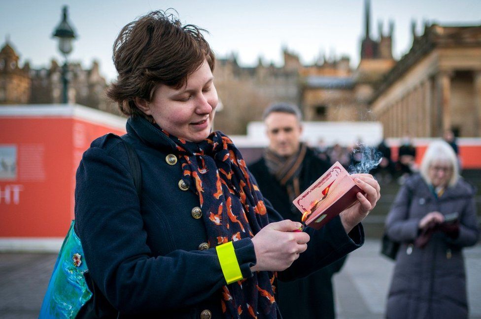 Anna Jakubova burns her Russian passport in Edinburgh
