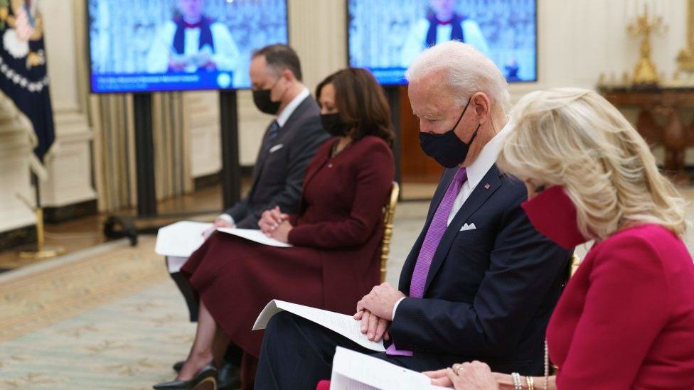 US President Joe Biden, First Lady Jill Biden, Vice President Kamala Harris and Second Gentleman Doug Emhoff, listen to the virtual Presidential Inaugural Prayer Service