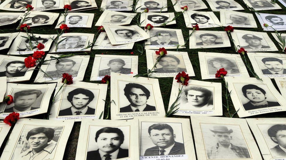 Photos of people who disappeared under the military rule of Gen Augusto Pinochet on display at a memorial