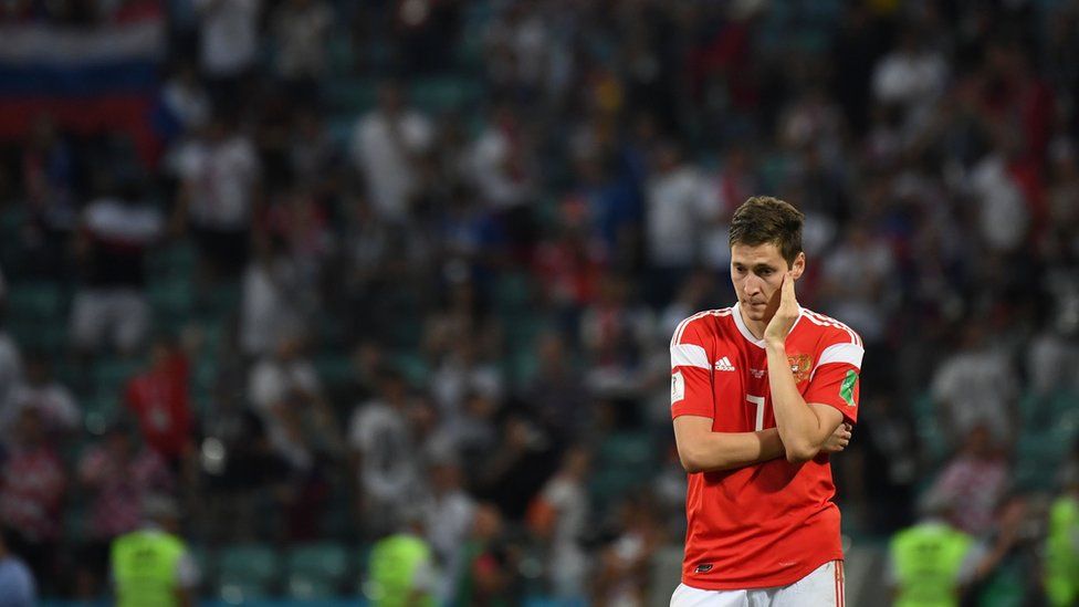 Russian midfielder Daler Kuzyaev reacts after the team lost their Russia 2018 World Cup quarter-final match to Croatia, 7 July 2018