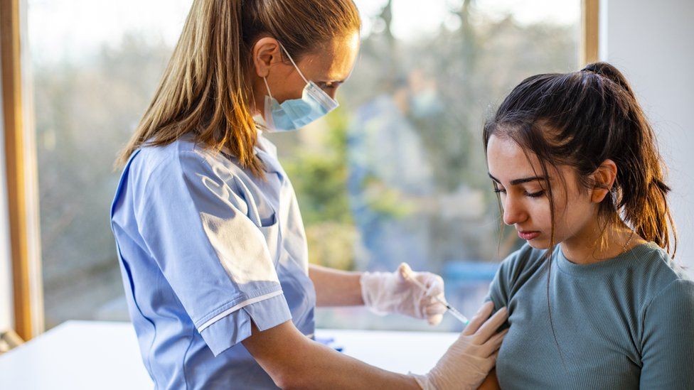 A teenager getting vaccinated
