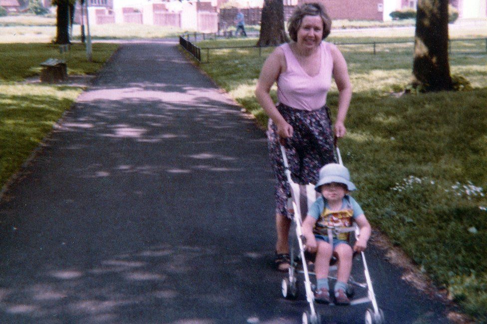 Irene with Iain in a pushchair, aged two-and-a-half