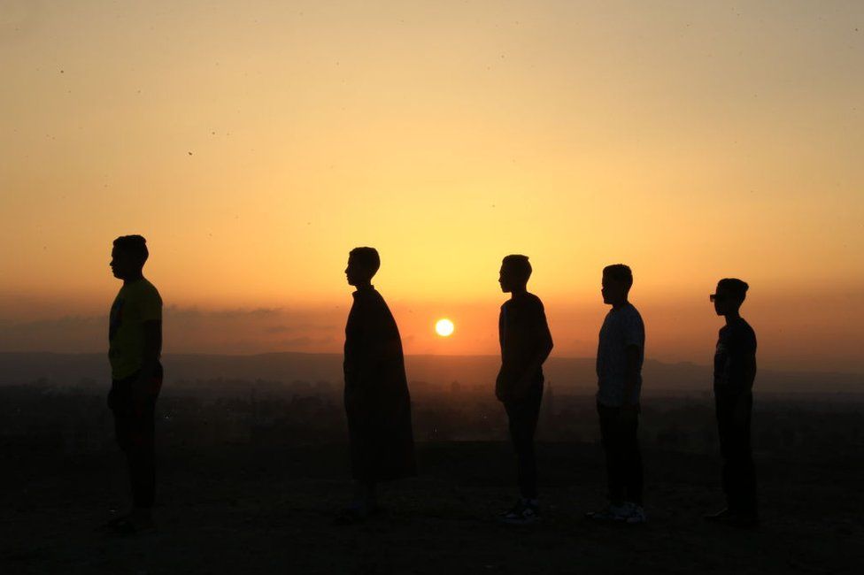 Muslims perform Eid al-Fitr prayers in Abu Sir village on 21 April.