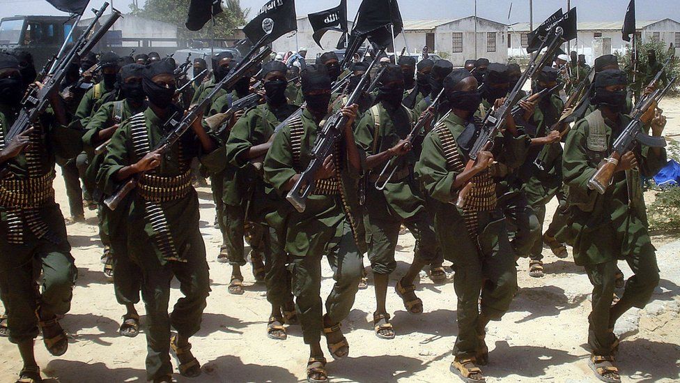 Al-Shabab fighters perform military drills at a village about 25km outside Mogadishu