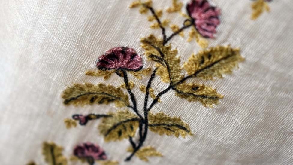 Close up of thistle embroidery on Regency day dress from 1800-1810
