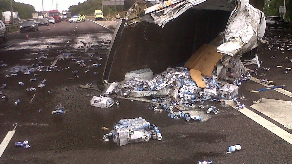 Lager cans spilled across M6