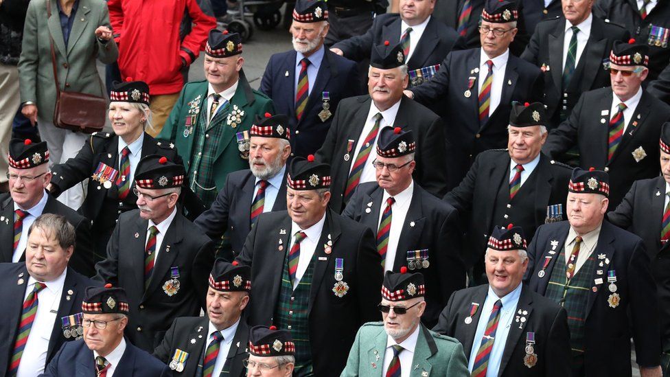 Ex-service personnel from Legion Scotland march down the Royal Mile in Edinburgh