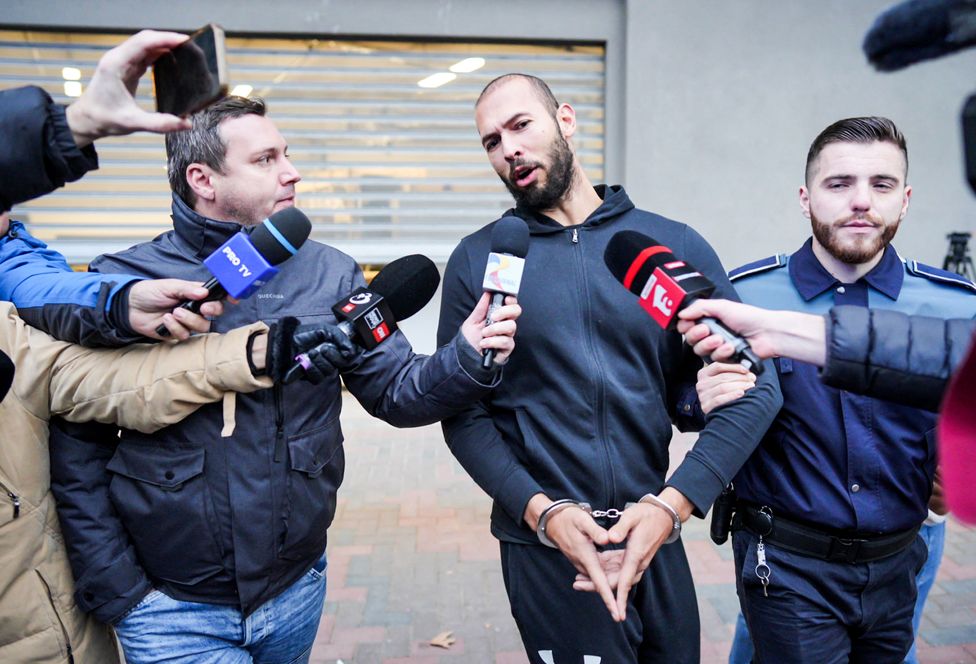 Andrew Tate talks to media as he leaves Romania's anti-organized crime and terrorism directorate in Bucharest, Romania, on 25 January 2023