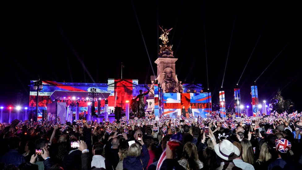 Royal fans watch Prince Charles and Camilla on stage at the Jubilee concert