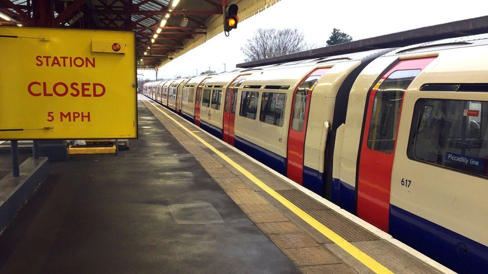 An empty Piccadilly line train stopped at Stamford Brook underground station