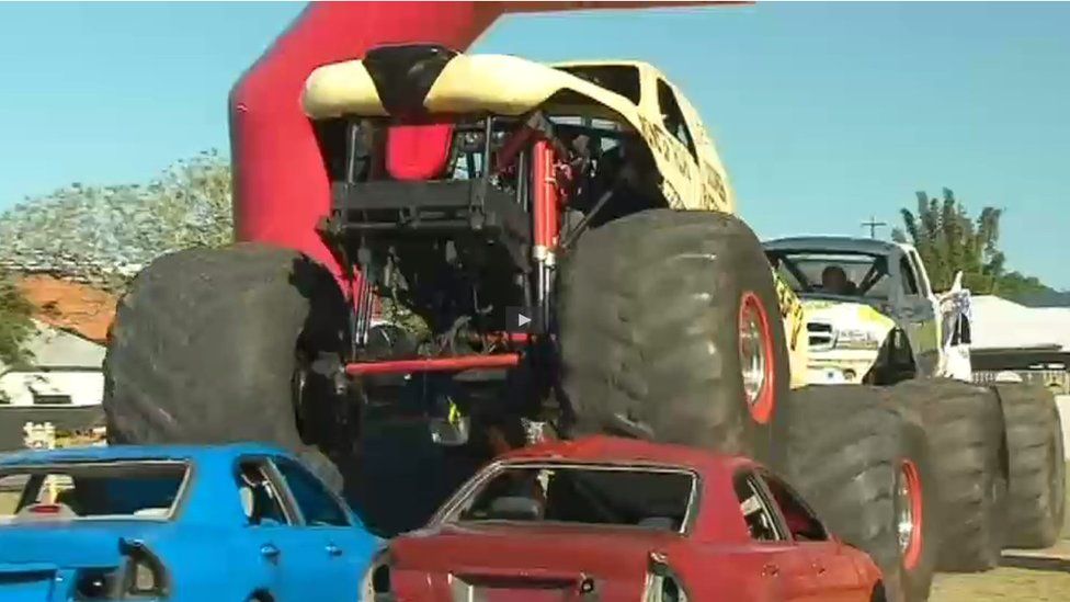 Pauline Hanson drives over cars in a monster truck