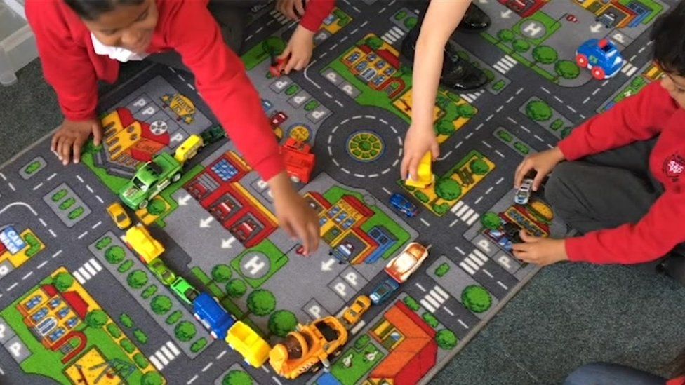 Children playing with toy cars
