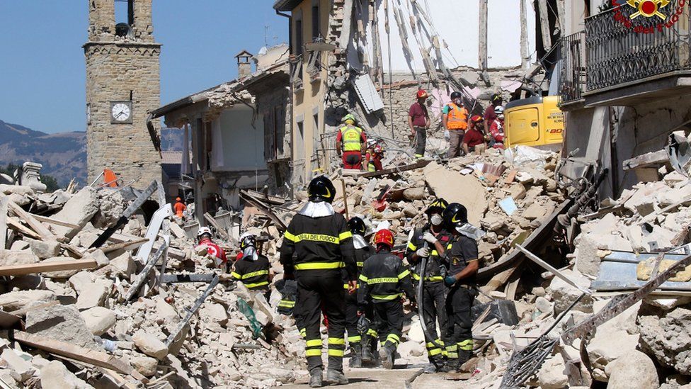 Rescuers work amid collapsed building in Amatrice, central Italy, Thursday, Aug. 25, 2016