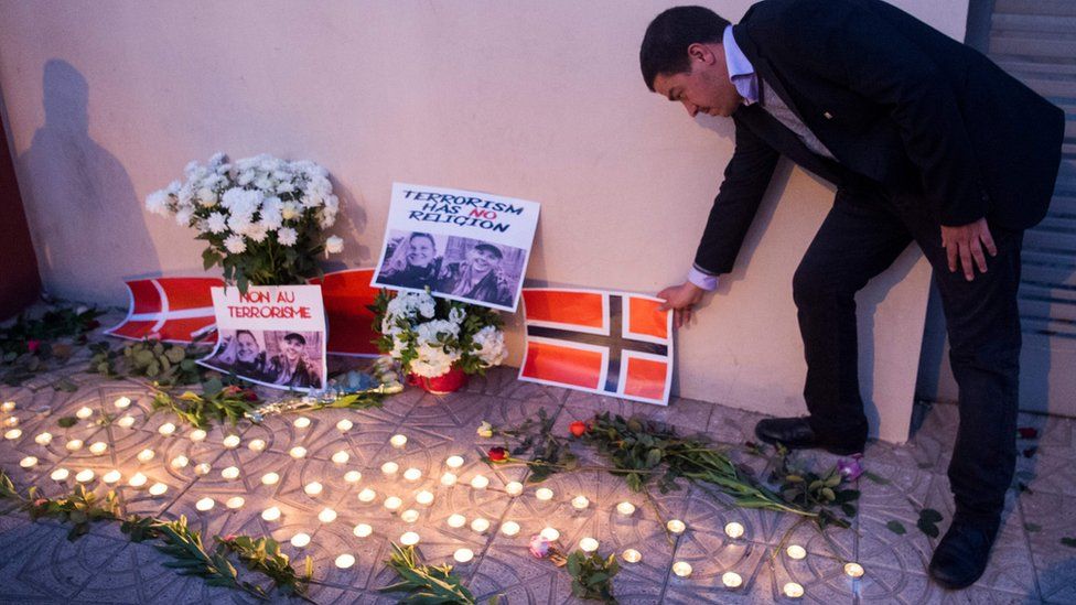 A vigil for two murdered tourists in Morocco