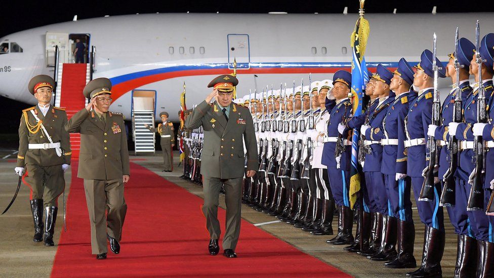 Russian Defence Minister Sergei Shoigu welcomed at an airport in Pyongyang on 25 July