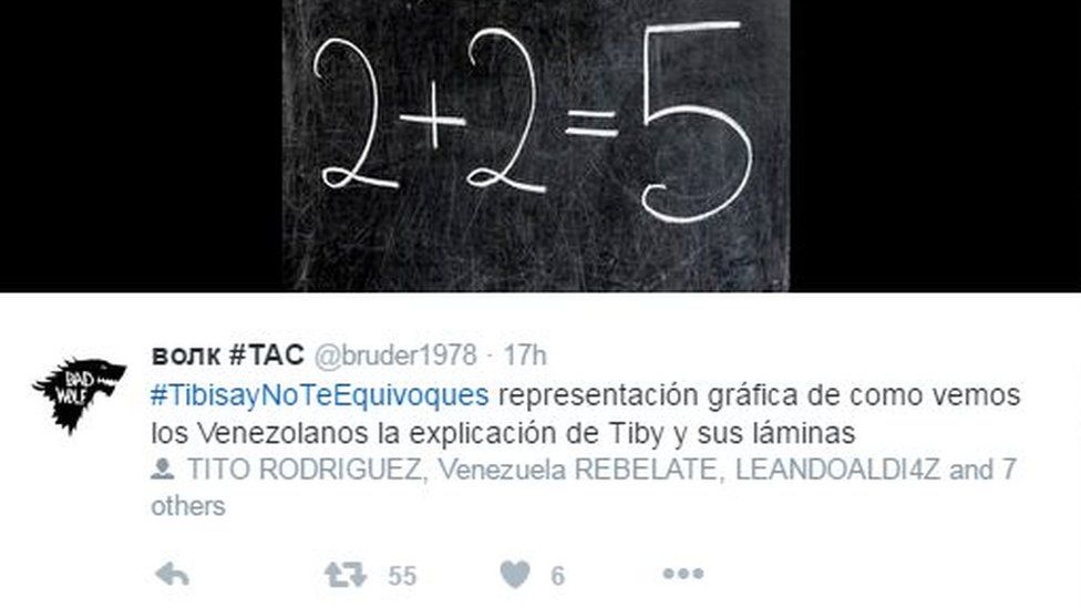 A screen grab of a tweet showing a blackboard and the equation two plus two equals five.