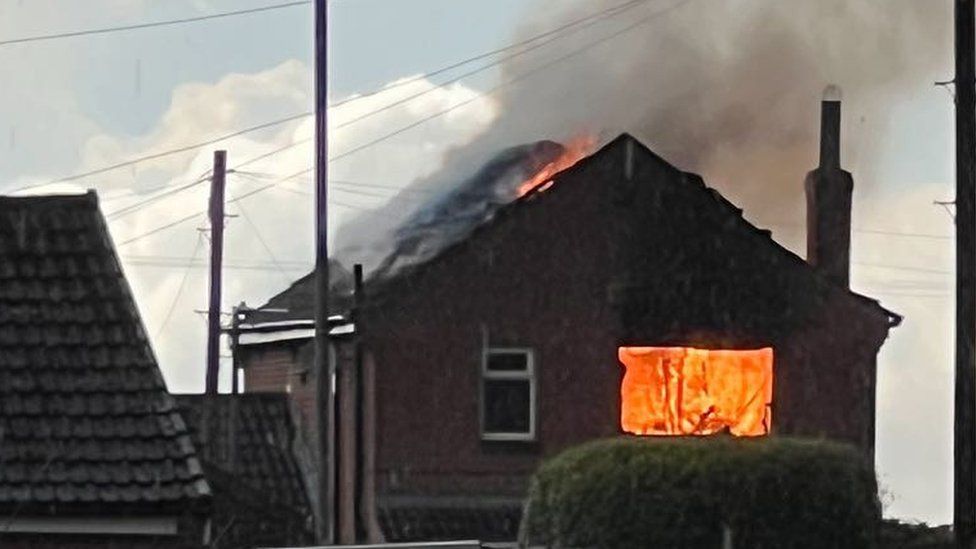 The house in Holme-on-Spalding-Moor on fire