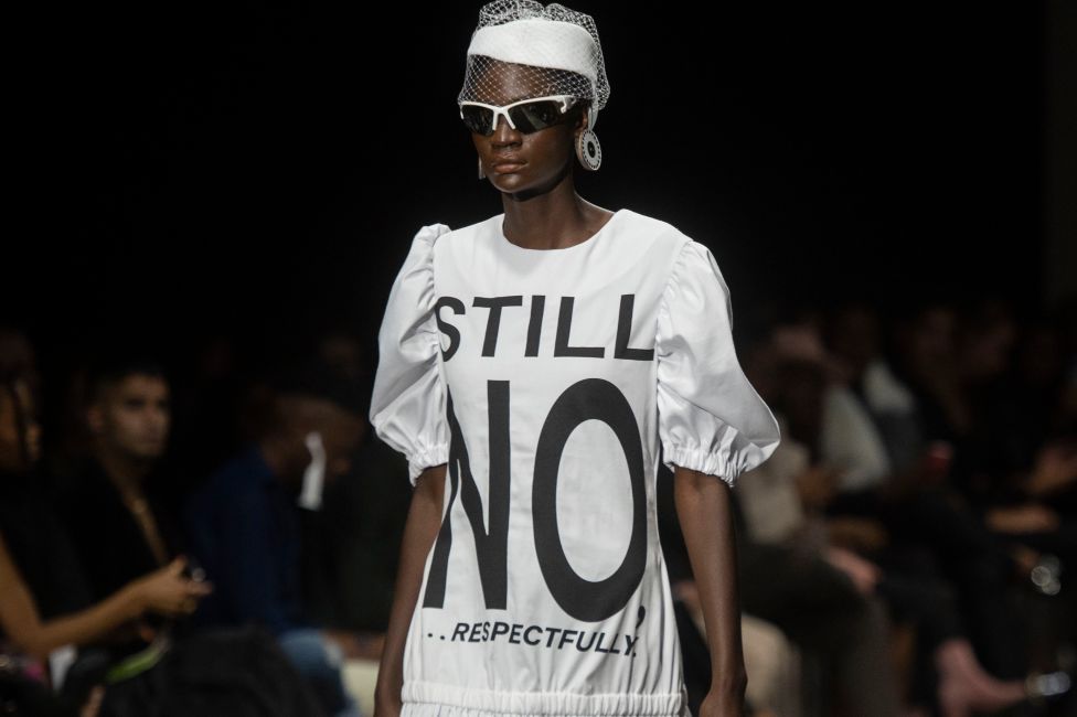 A model in a dress with the words "Still No... Respectfully" taking part in the South African Fashion Week Spring/Summer 2022 Collection, Johannesburg, South Africa - Friday 29 April 2022