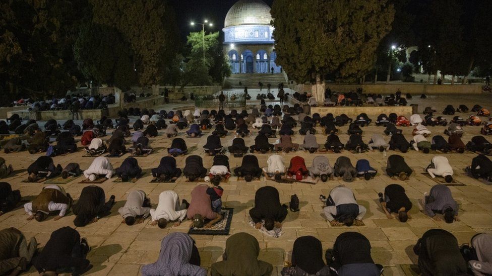 Palestinian Muslims attend prayers for the first time in more than two months at Al-Aqsa Mosque