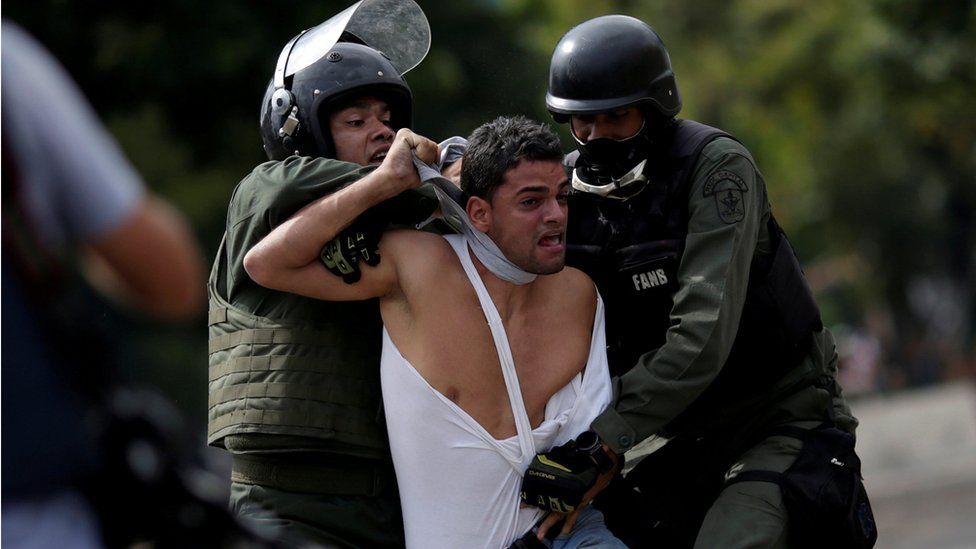 A demonstrator is detained at a rally during a strike called to protest against Venezuelan President Nicolas Maduro's government in Caracas, Venezuela, July 27, 2017