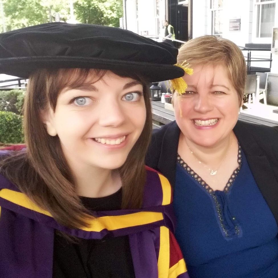 Becky getting her PhD from Manchester University, with Julie