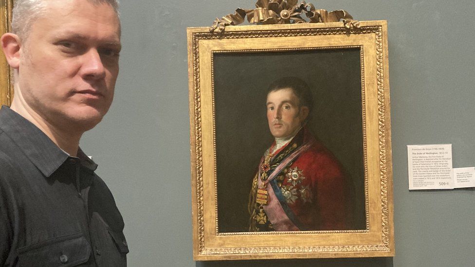 Christopher Bunton alongside the Goya painting of Duke Wellington that his grandfather Kempton stole and took home to Newcastle