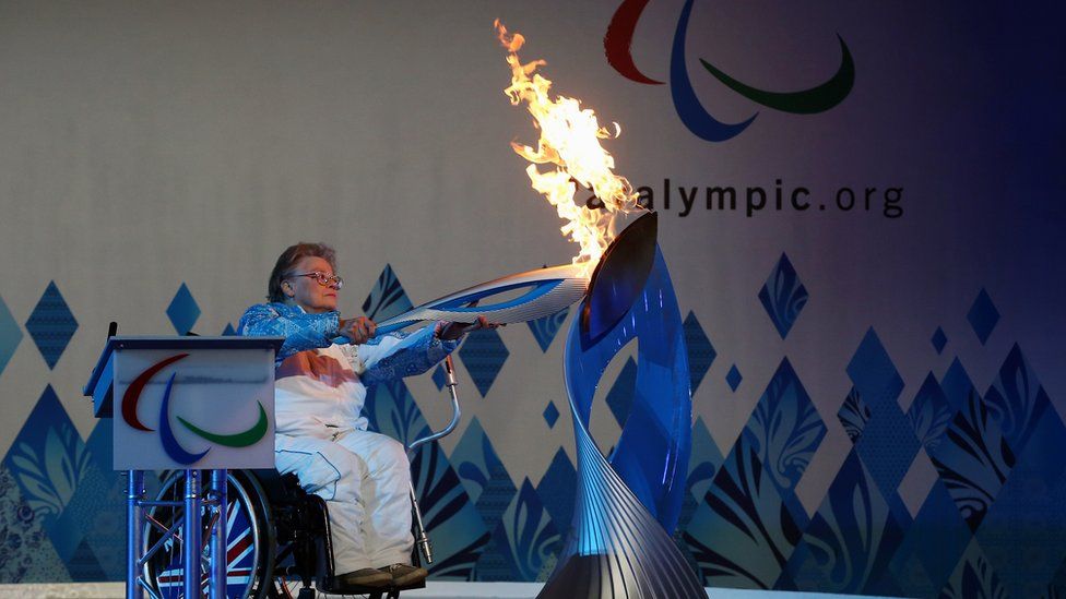 Paralympian Caz Walton with Paralympic Heritage Flame