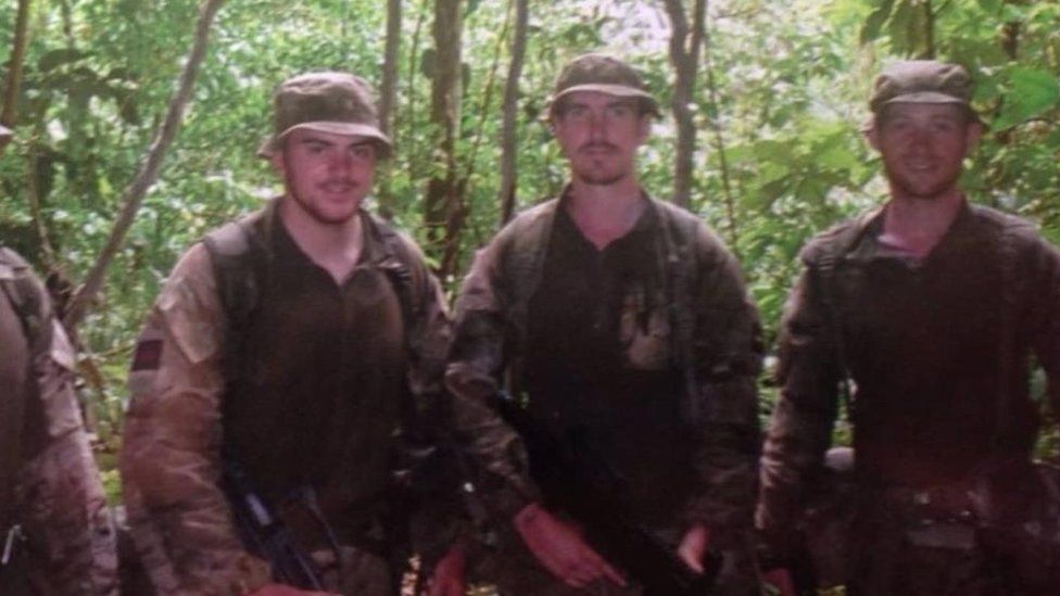 Craig (right) and two other soldiers in uniform