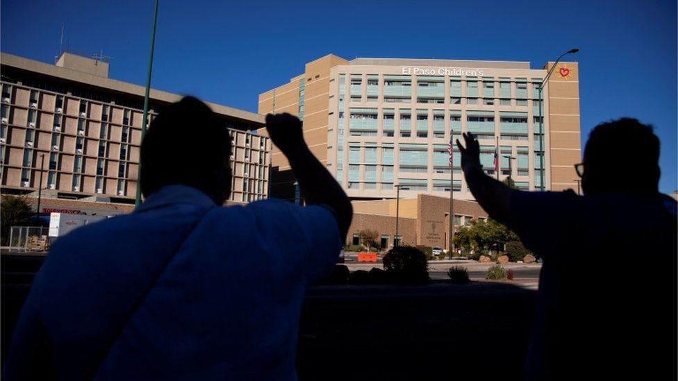 People praying outside El Paso hospital