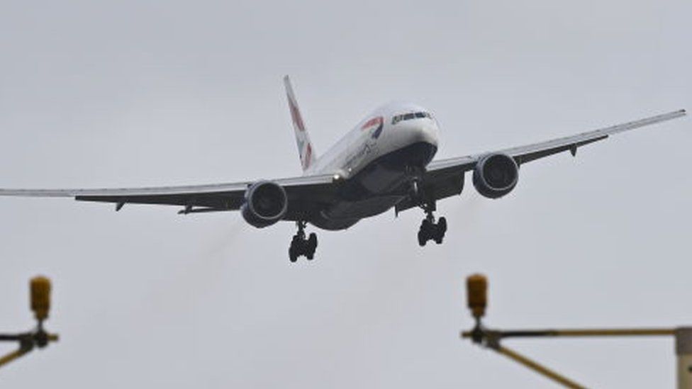 A British Airways plane struggles with high winds on its approach to Heathrow