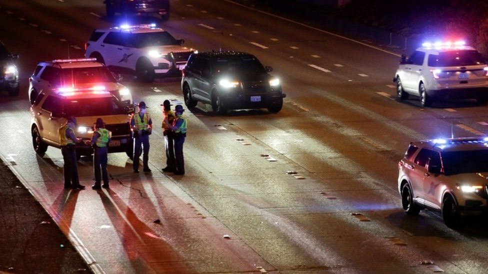 Police at the scene where Seattle protesters were hit by a car