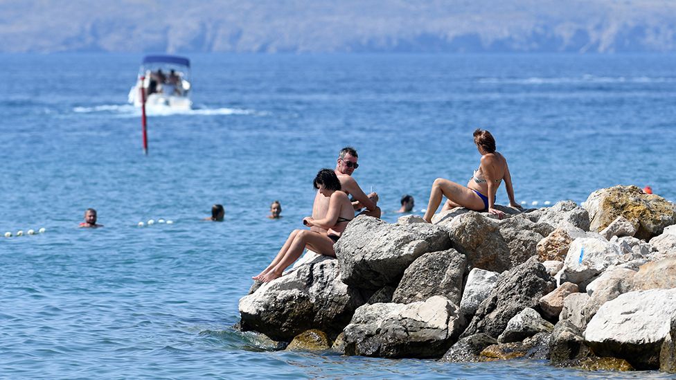 Croatian coastline and sunbathers
