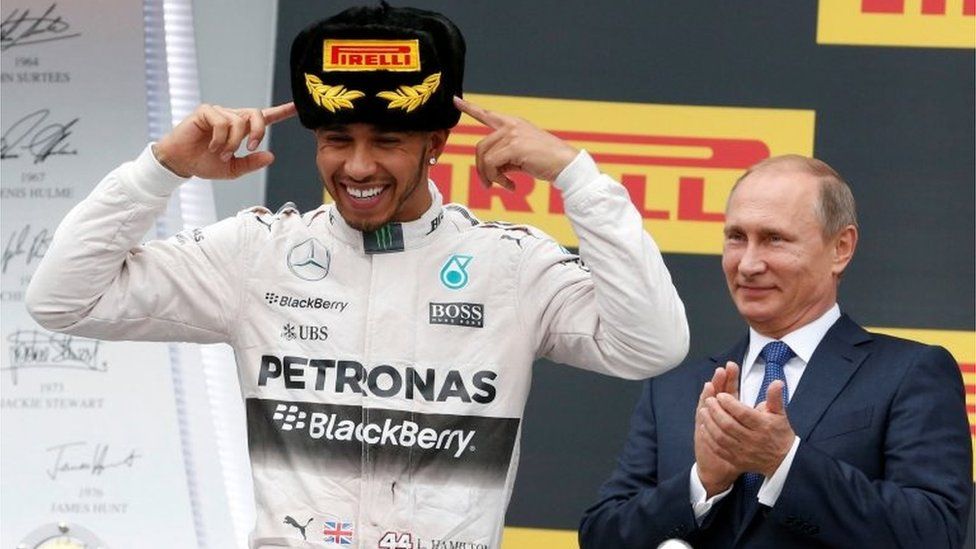 Russian President Putin watches Mercedes" Hamilton celebrates after winning Russian F1 Grand Prix in Sochi