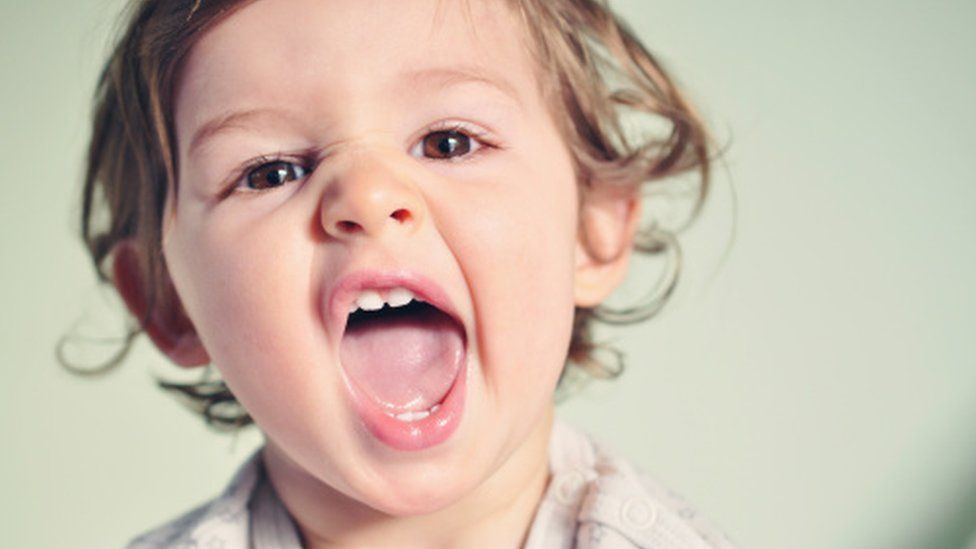 Toddler showing teeth