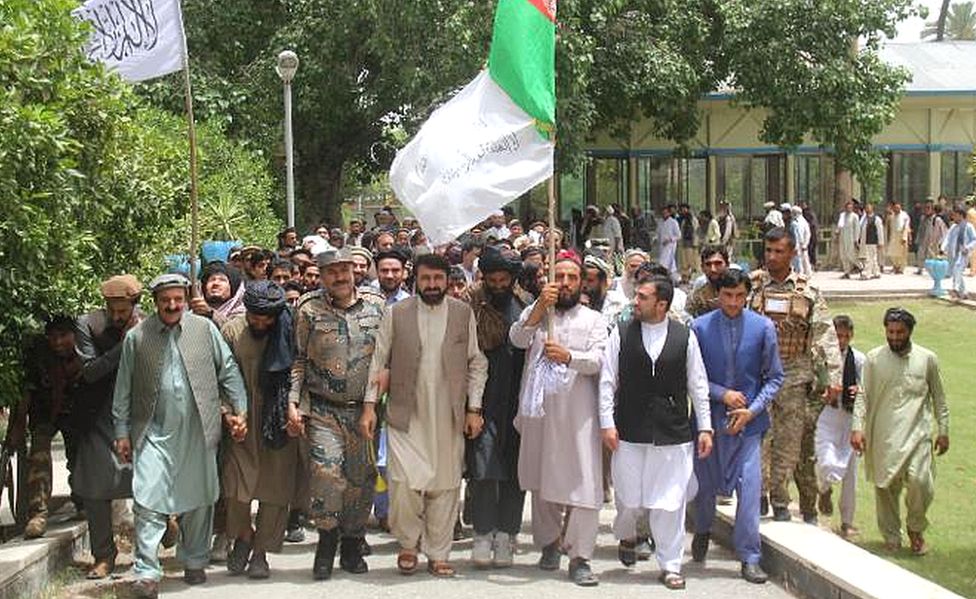 Hayatullah Hayat leads a joint procession of government forces and Taliban fighters during the 2018 ceasefire