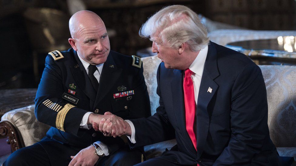 US President Donald Trump shakes hands with US Army Lieutenant General H.R. McMaster (L) as his national security adviser at his Mar-a-Lago resort in Palm Beach
