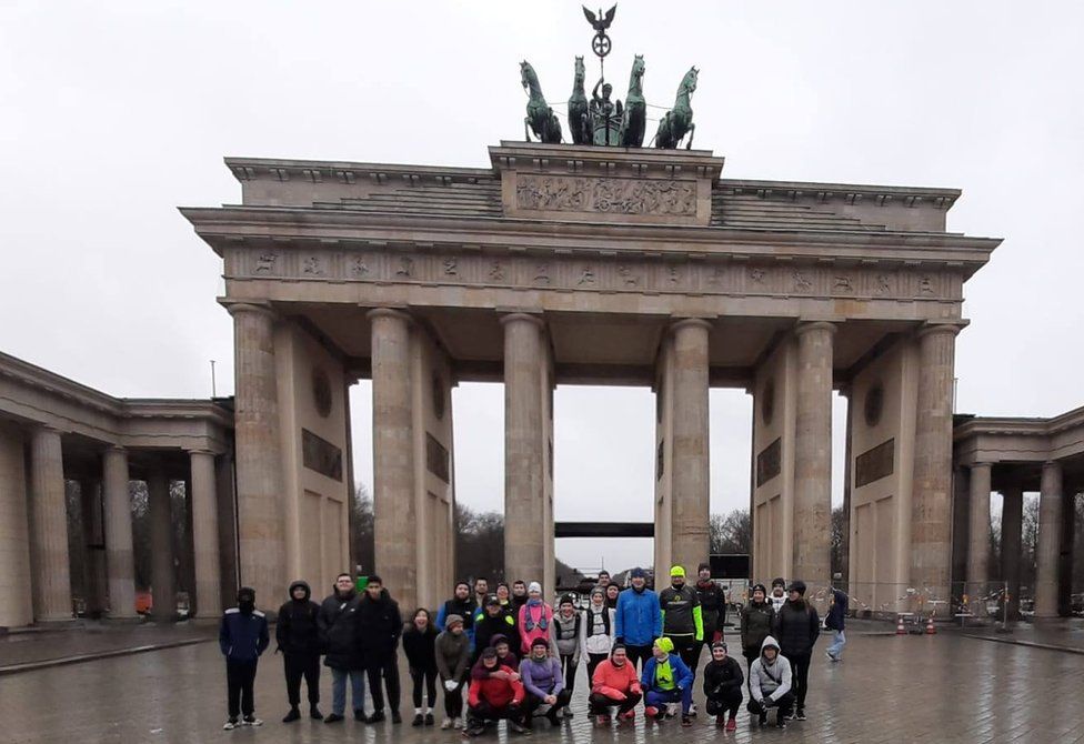 Runners in front of the Brandenburg Gate in Berlin
